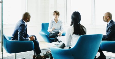 Businesswoman leading meeting in office