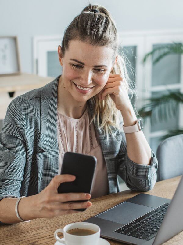 Happy looking woman on her mobile phone